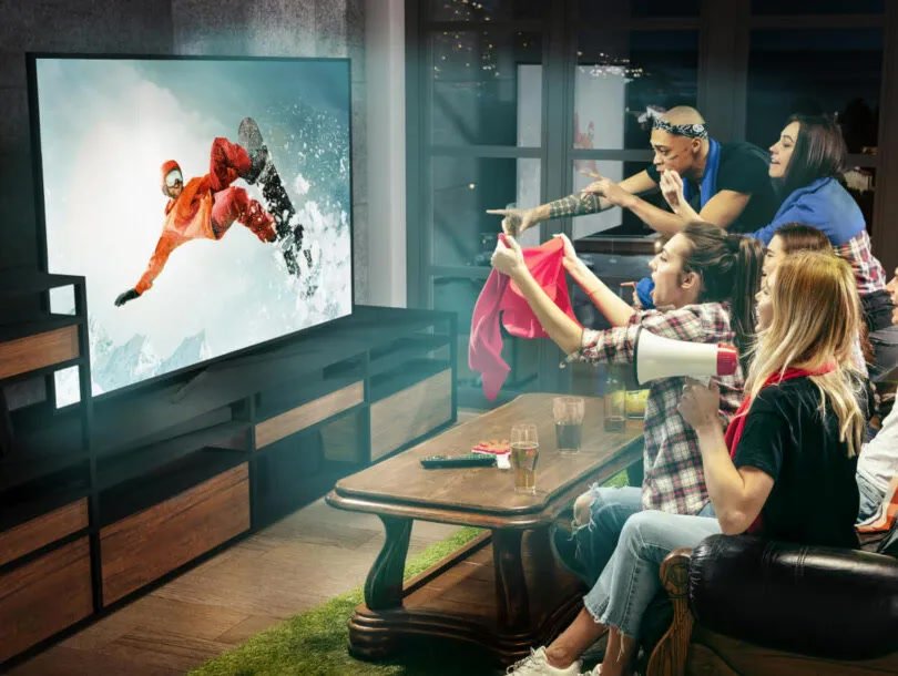 Friends watching live sports channels with an IPTV Ireland service
